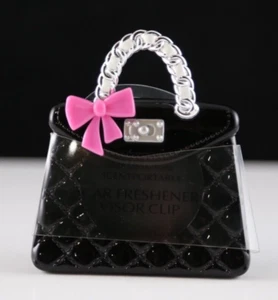Neu Bath & Body Works duftender tragbarer Auto-Visierclip - rosa Schleife auf schwarzer Handtasche - Bild 1 von 3
