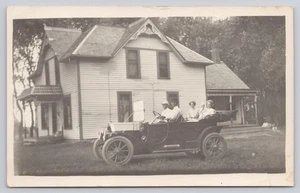 RPPC Family in Antique Auto Car House in Background c1904-1918 Postcard - Picture 1 of 2