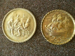 TWO SMALL PRESSED BRASS WALL PLATES, ONE GALLEON THEMED, ONE A TAVERN SCENE - Picture 1 of 7