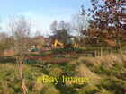 Photo 6x4 Heavy Digging? Coalville A JCB stands next to a vegetable patch c2006