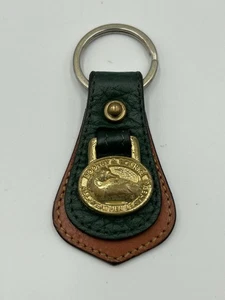 Portachiavi Dooney & Bourke vintage in pelle verde e marrone per tutte le condizioni atmosferiche ottone fob anatra - Foto 1 di 6