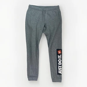 Petit pantalon de survêtement conique gris homme Nike Sportswear polaire Just Do It - Photo 1/7