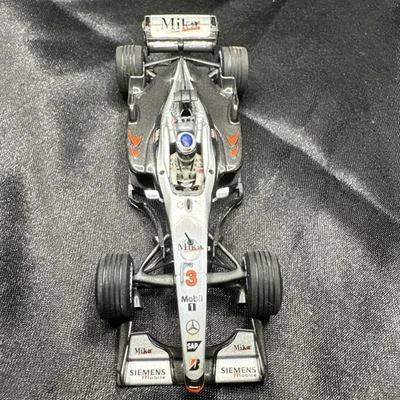 Minichamps 1/43 McLaren Mercedes MP4-13 MP4-14 Mika Hakkinen 1999 USA - Image 1 of 4