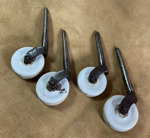 4 MATCHING ANTIQUE CERAMIC WHEEL CASTERS 1” INCH WHEELS 4” LONG. USED BUT SOLID! Cover
