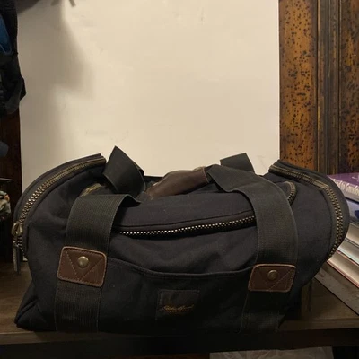 Bolso de mano vintage Eddie Bauer de lona para gimnasio equipaje de lona negra con adornos de cuero Foto 1 de 4
