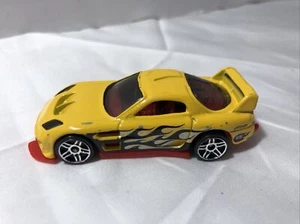 24/Seven 1/64 die-cast loose Hot Wheels yellow  racer with black flames - Picture 1 of 7