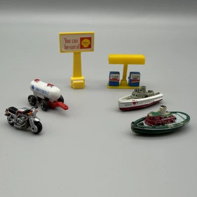 Vintage 1980s Micro Machines Lot Motorcycle Boats Anhydrous Trailer Shell Sign - Image 1 of 4
