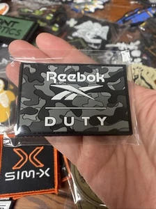 NEU 2025 SHOT SHOW Reebok Dienst Militär Stiefel Ausrüstung TAKTISCH Patch Waffen Schusswaffen - Bild 1 von 1