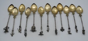 FRILLI BELLE SUITE DE 12 CUILLERES A MOKA EN ARGENT MASSIF et VERMEIL PERSONNAGE - Picture 1 of 10