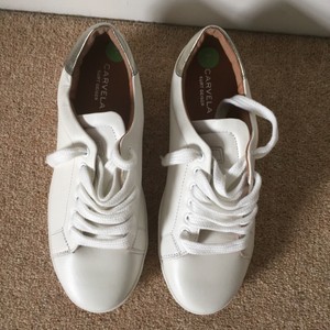 kurt geiger white and gold trainers
