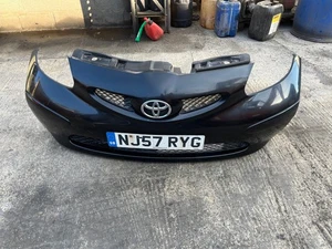 2007 TOYOTA AYGO FRONT BUMPER + GRILLE IN BLACK - Picture 1 of 12