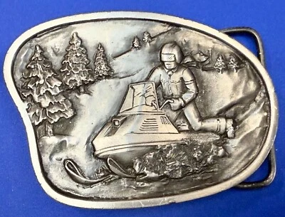 Snowmobile Winter Sports Snowy Mountain Scene Vintage 1977 Bergamot Belt Buckle - Image 1 of 4