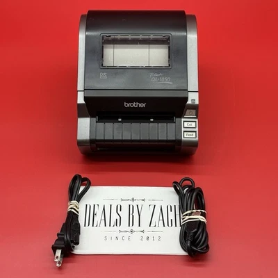 Impresora térmica directa de gran formato Brother P-Touch QL-1050 con cables de alimentación y USB Foto 1 de 4