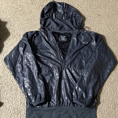 Chaqueta cortavientos Oakley para hombre pequeña estilo surf azul ligera con capucha cremallera Foto 1 de 4