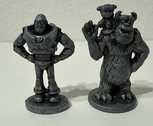 Disney Estatuillas de Peltre Fichas Edición Monopoly Pixar Juego de Mesa Scully Buzz 2 piezas - Imagen 1 de 5