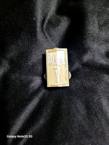 OEM VINTAGE 1977- 1979 LINCOLN MARK V GRILL BADGE IN SILVER AND GOLD BACK GROUND - Picture 1 of 3