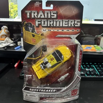 Transformers Universe G1 SUNSTREAKER Deluxe Class Race Car Robot con bláster NISC Foto 1 de 2