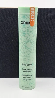 Amika The Kure Bond Repair Shampoo For Damaged Hair 9.2 Oz Amber Vanilla Scent - Image 1 of 3