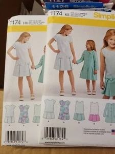 Simplicity 1174 Mädchen Kleid Mantel & Jacke 3-6, 7-14, - Bild 1 von 2