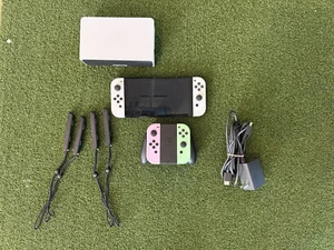 OLED Nintendo Switch + Dock + 4 Joy-Cons/Straps + Gaming Grip + Charger + HDMI - Picture 1 of 8