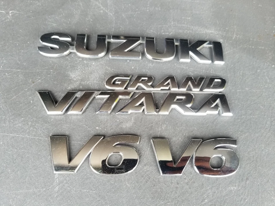 Suzuki Grand Vitara V6 2006-2011 emblema cromado insignia logotipo símbolo de fábrica OEM  Foto 1 de 1