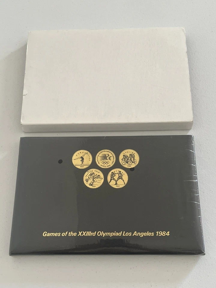 1984 LOS ANGELES OLYMPICS TRANSIT TOKEN COIN SET w/24 COINS Sealed - Image 1 of 1