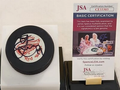STEVE YZERMAN signed RED WINGS puck JSA COA - Image 1 of 2