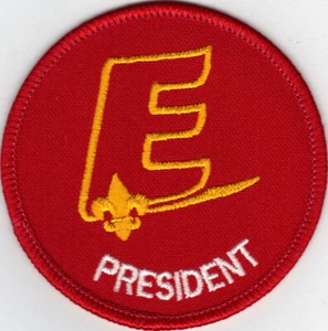 Parche Explorer President Position (1990-98), dorado "E", parte posterior de plástico transparente - Imagen 1 de 1