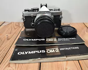 Olympus OM-2N fotocamera reflex pellicola Zuiko MC 50 mm obiettivo F1.4 e manuali - Foto 1 di 13
