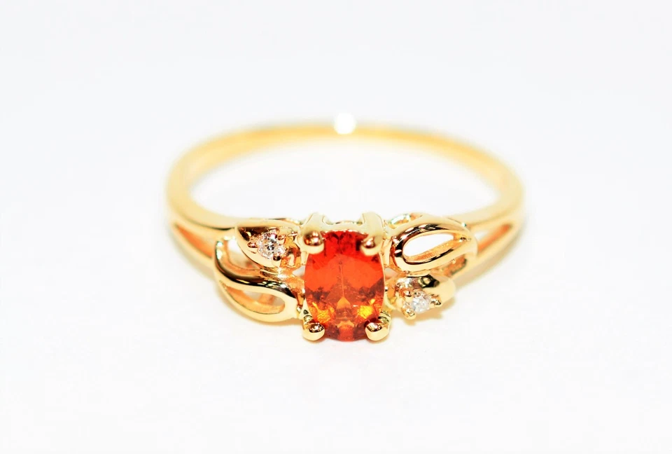 Кольцо из чистого золота 14 карат с натуральным мандарином гранатом и бриллиантом 0,55 карата - Изображение 1 из 4
