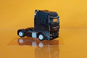 Herpa 315876-002 MAN TGX GX Zugmaschine mit Spiegelkameras schwarz 1:87 NEU LKW - Picture 1 of 2