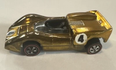 McLaren M6A 1969 Redline Hot Wheels de colección dorado negro interior EE. UU. Foto 1 de 4
