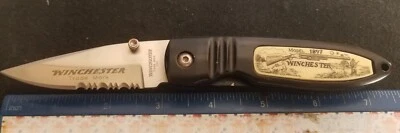 Cuchillo Winchester Modelo 1897 Scrimshaw Linerlock, Mangos Compuestos Blancos "  Foto 1 de 4