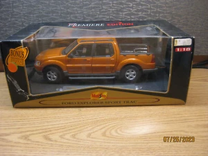 1/18 2002 Ford Explorer Sport Trac in Gold von Maisto # 36891 - Bild 1 von 14