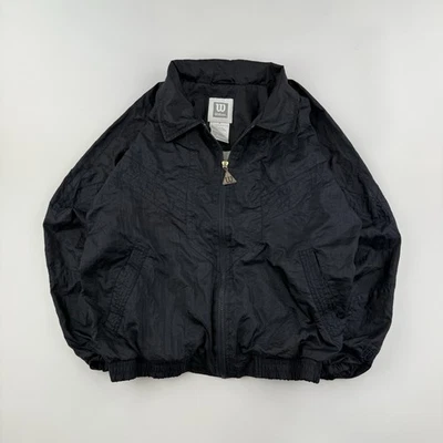Chaqueta cortavientos vintage Wilson para mujer M negra de nailon con cremallera bolsillos años 90’s Foto 1 de 4
