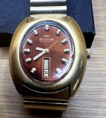 RELÓGIO AUTOMÁTICO MASCULINO VINTAGE DUVAL, MOSTRADOR MARROM DIA/DATA, CAIXA OVAL OVO, FUNCIONANDO - Imagem 1 de 4