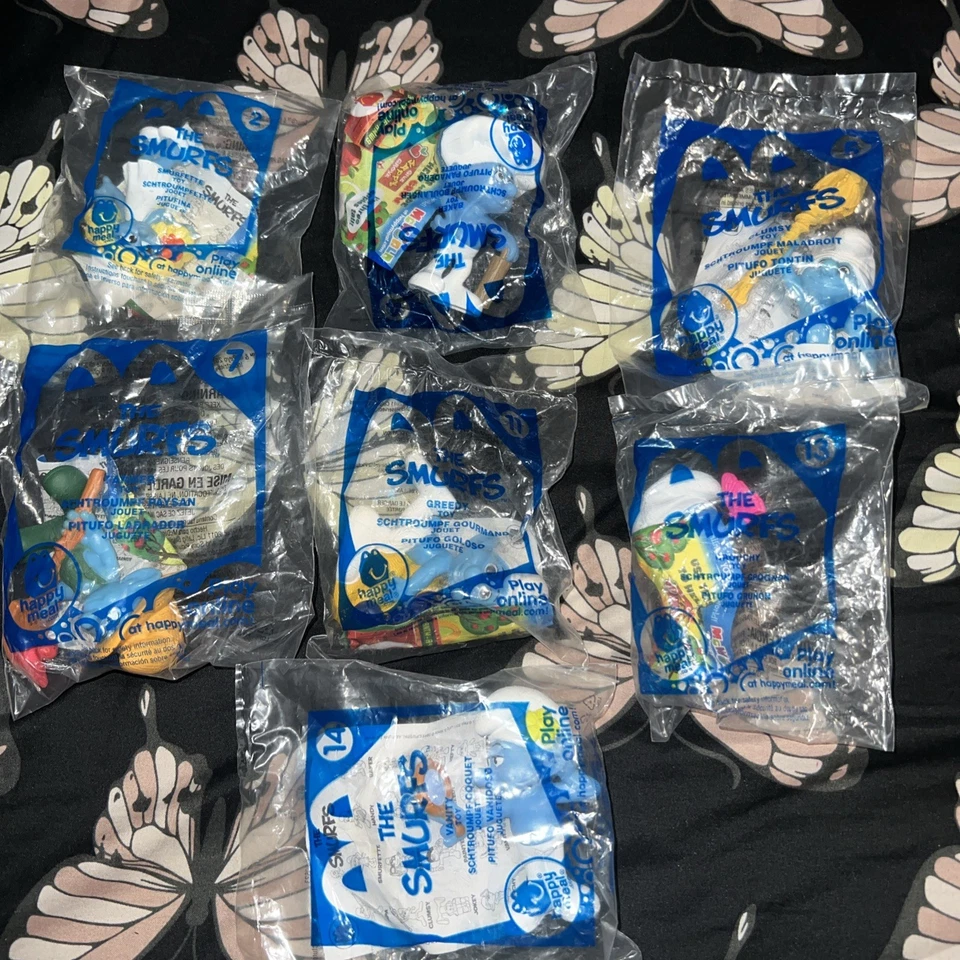 Brinquedos McDonald's 2011 Smurfs Happy Meal pacote lacrado 7 brinquedos - Imagem 1 de 4