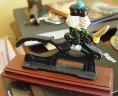 Vintage Cast Iron Nut Cracker Wood Base Hand Painted Metal Soldier King w/ Sword - Image 1 of 2