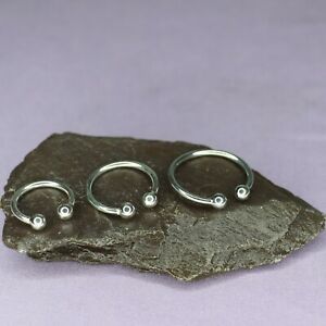 LADIES, GIRLS ADJUSTABLE STERLING SILVER TORQUE BALL RING. 