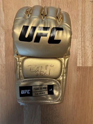 Jon “Bones” Jones Fighter Autographed Signed Gold UFC Glove. Beckett. Inscribed - Image 1 of 2