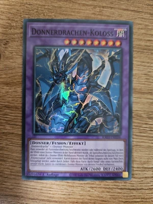 Donnerdrachen-Koloss RA03-DE036 Super Rare Deutsch NM YUGIOH - Bild 1 von 2