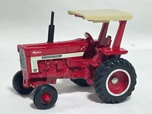 ERTL 1/64 International 1066 Hydro w/ ROPS, white stripe, Red Farm Toy Tractor - Picture 1 of 2