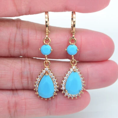Pendientes colgantes de gota de agua de topacio azul lago rellenos de oro amarillo de 18 quilates para mujer Foto 1 de 4