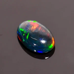 Natural Black Ethiopian Opal Oval Shape Fire Cabochon Gemstone 12X8X4 mm 2 Ct - Picture 1 of 3