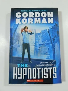 The Hypnotists by Gordon Korman - Scholastic Hardcover EXCELLENT - Bild 1 von 3