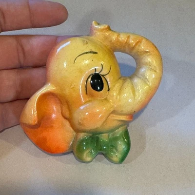 Placa de pared con cabeza de elefante de tiza vintage años 50 amarillo naranja verde arco Foto 1 de 4