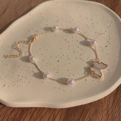Pulsera con dije de mariposa de perlas blancas para mujer, pulsera de mariposa ajustable Foto 1 de 4