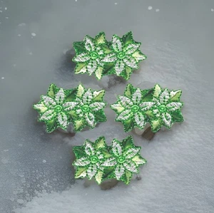 Lote de 4 parches de Navidad Poinsettia hierro bordado recortado a coser - Imagen 1 de 3