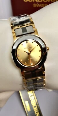 Reloj SunBorn Tungsteno Y Cerámica Damas Esfera Dorada 60086l Movimiento Cuarzo Foto 1 de 4