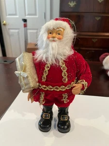 Santa Ornament Dressed in Red with Gold Trim and Gold Gift - Picture 1 of 4